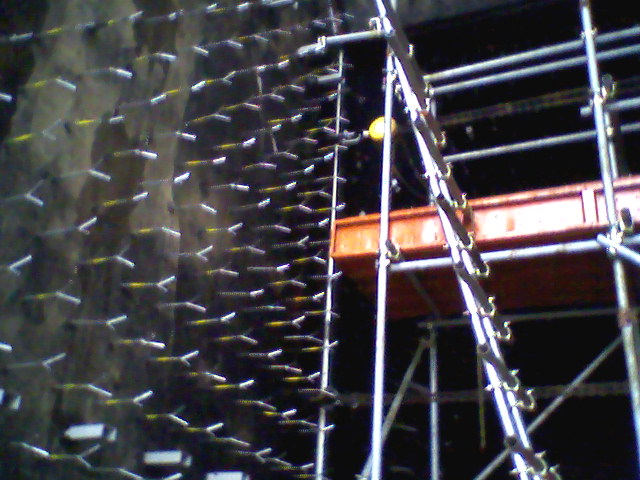 Engineer conducting a site inspection of industrial structures