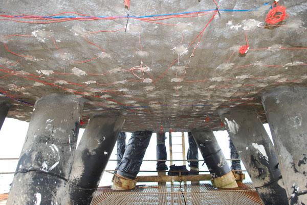 Embedded anodes installed beneath a concrete structure